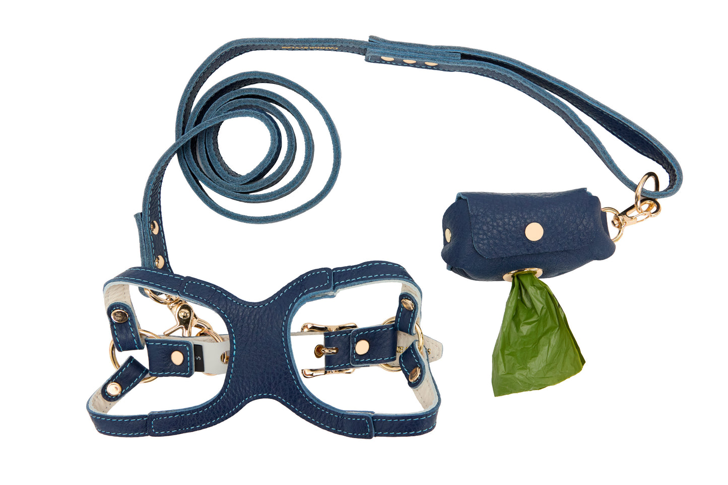 Blue leather dog harness and leash set with a poop bag holder on a white background