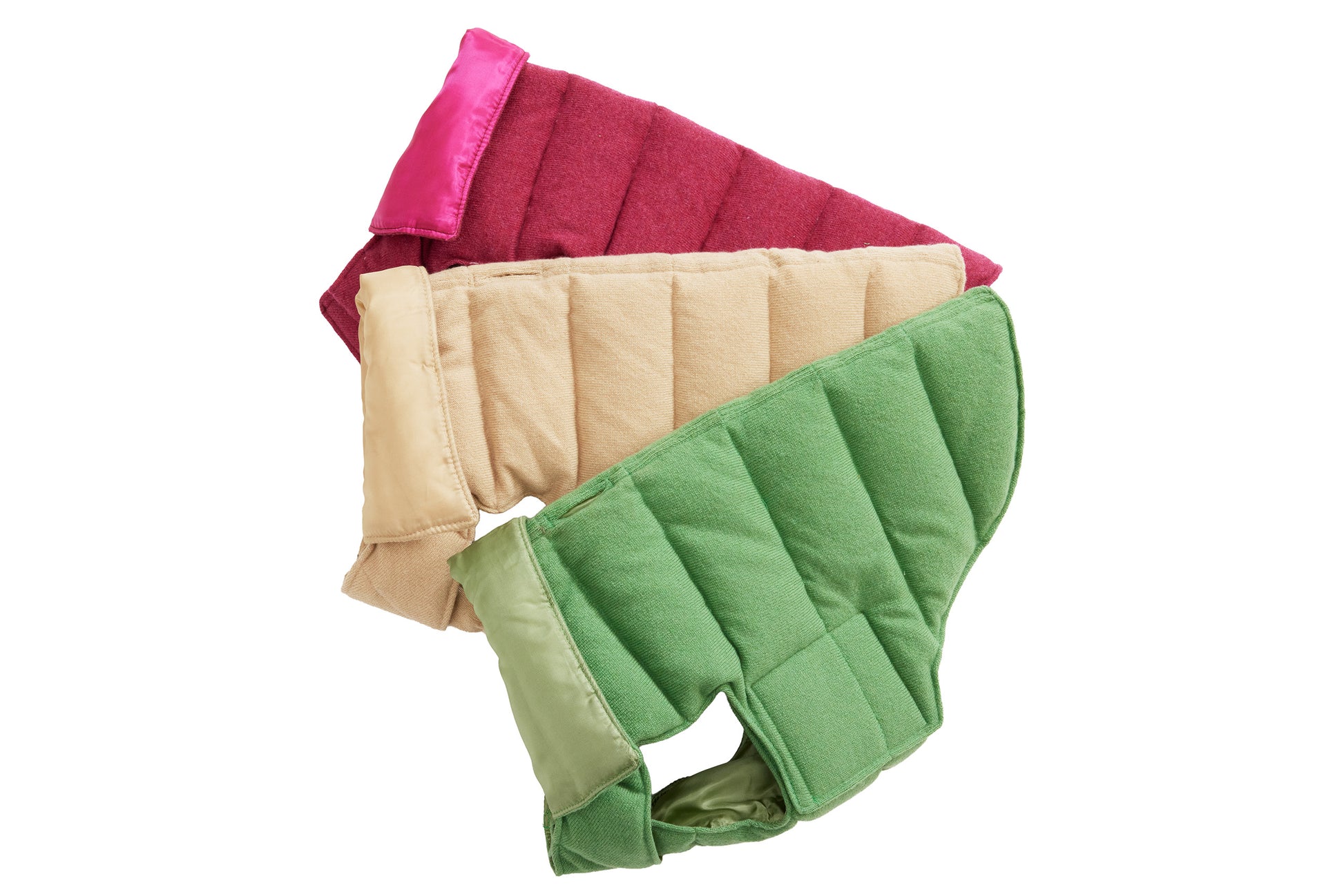Three dog puffer coats in cranberry red, oatmeal beige, and apple-green colors, displayed in a stacked arrangement.