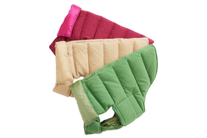 Three dog puffer coats in cranberry red, oatmeal beige, and apple-green colors, displayed in a stacked arrangement.