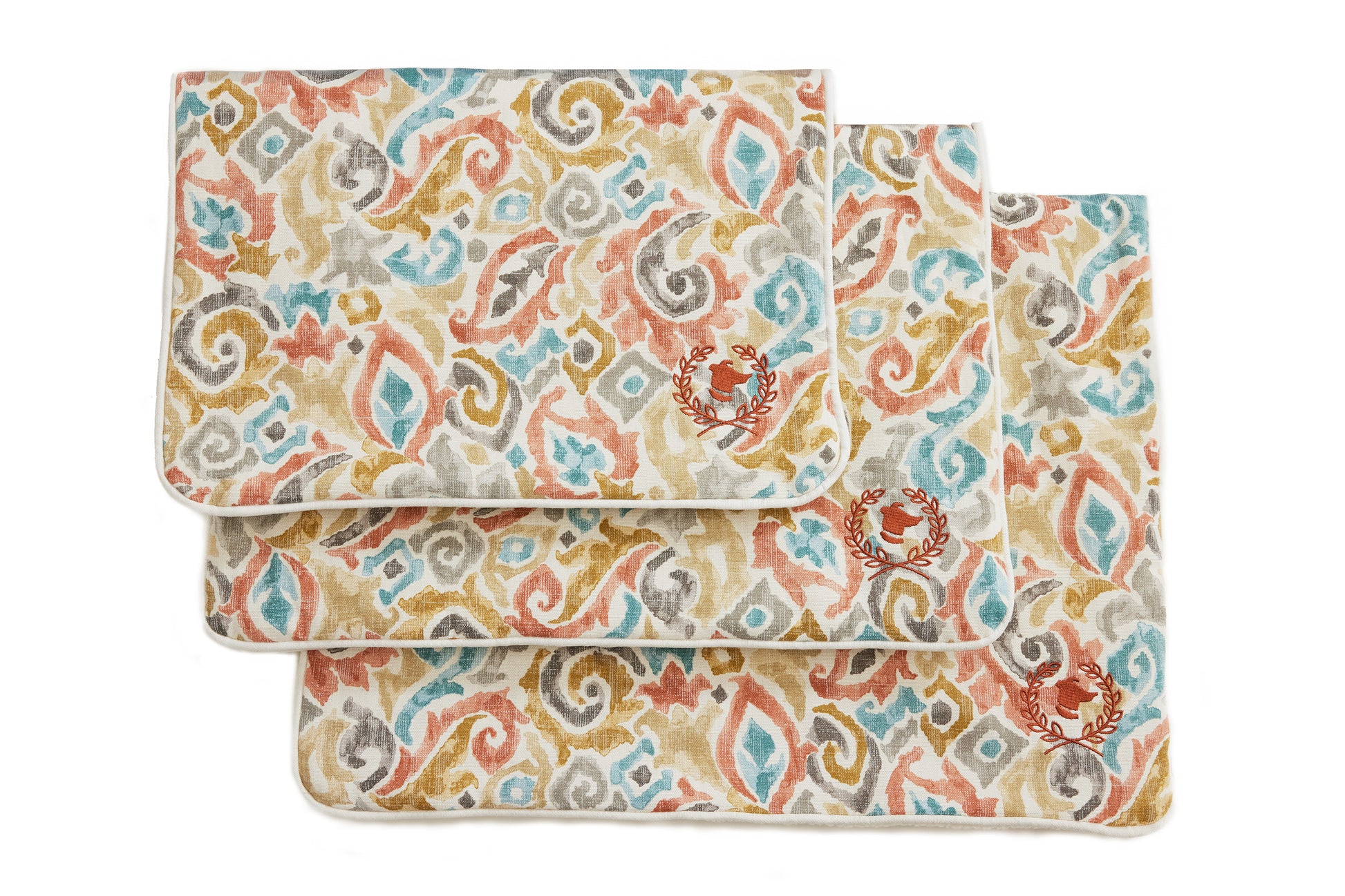 A rectangular crate mat with a floral pattern in beige, blue, and multicolor, designed for pets.