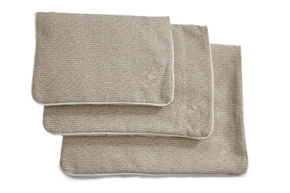 A beige crate mat made of cotton fabric and Sherpa, designed for pets, displayed in a folded manner against a white background.
